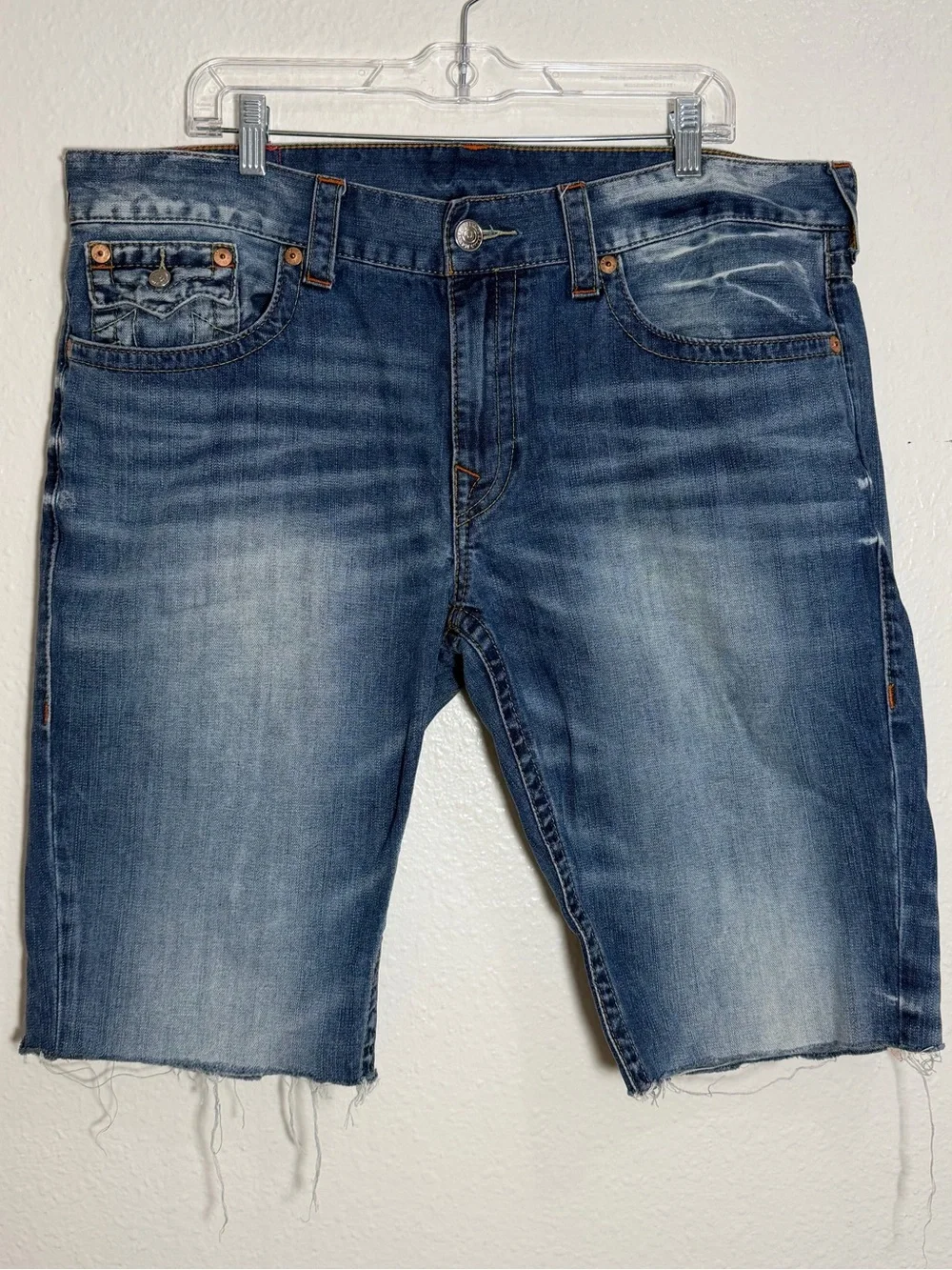 True Religion contrast denim shorts, distressed blue wash and raw, frayed hem 38